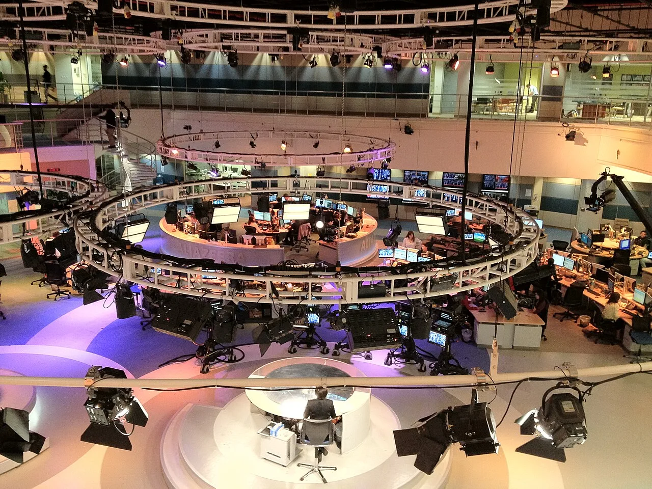 Journalists working in a modern digital newsroom
