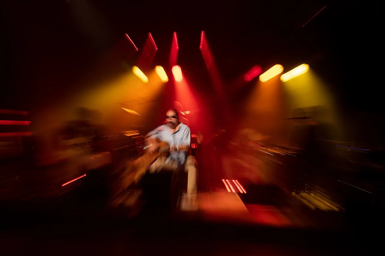 A concert recorded for live streaming with cameras and stage lights