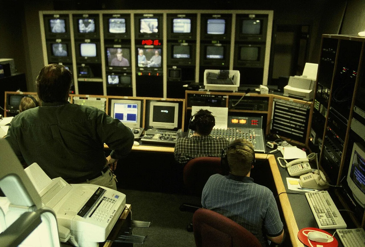 Video production team comparing several live camera feeds