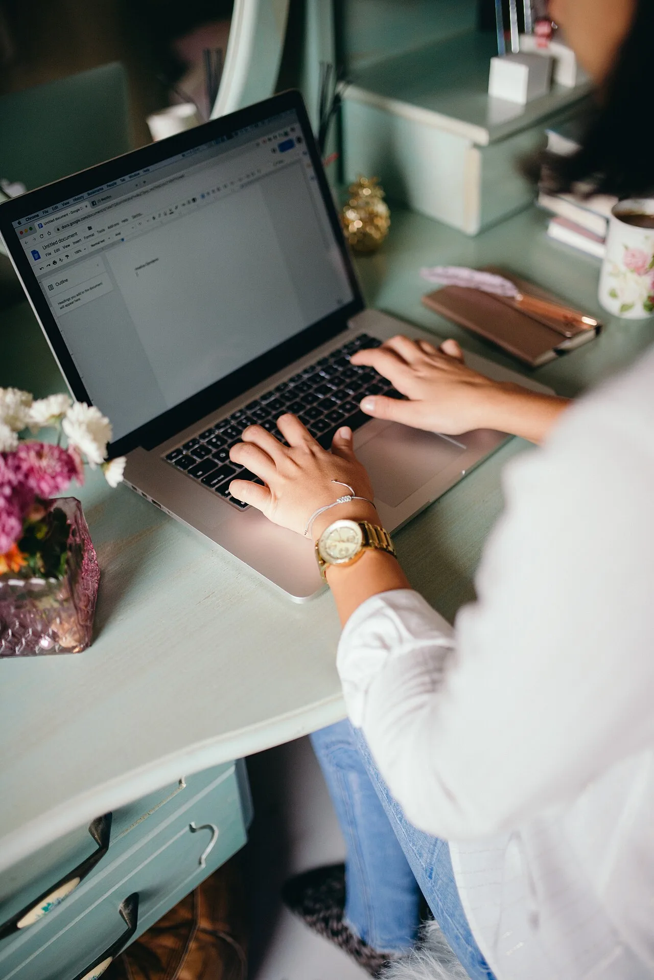 Woman using a laptop at home to illustrate live cam viewing