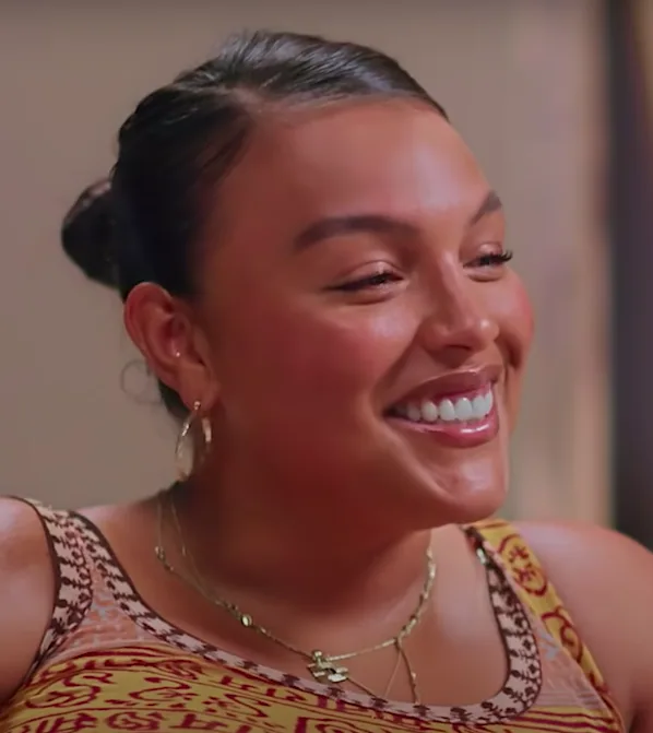 Plus-size model appearing in a recorded interview frame